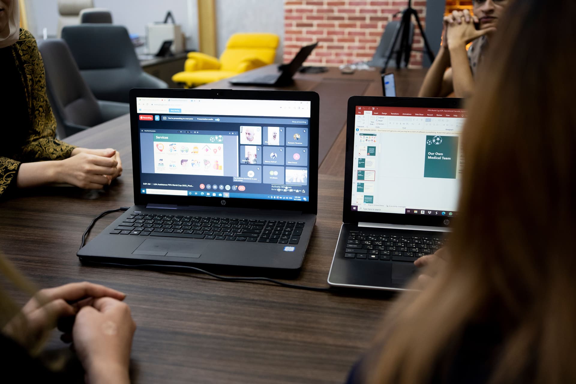 Business laptops in use during a meeting