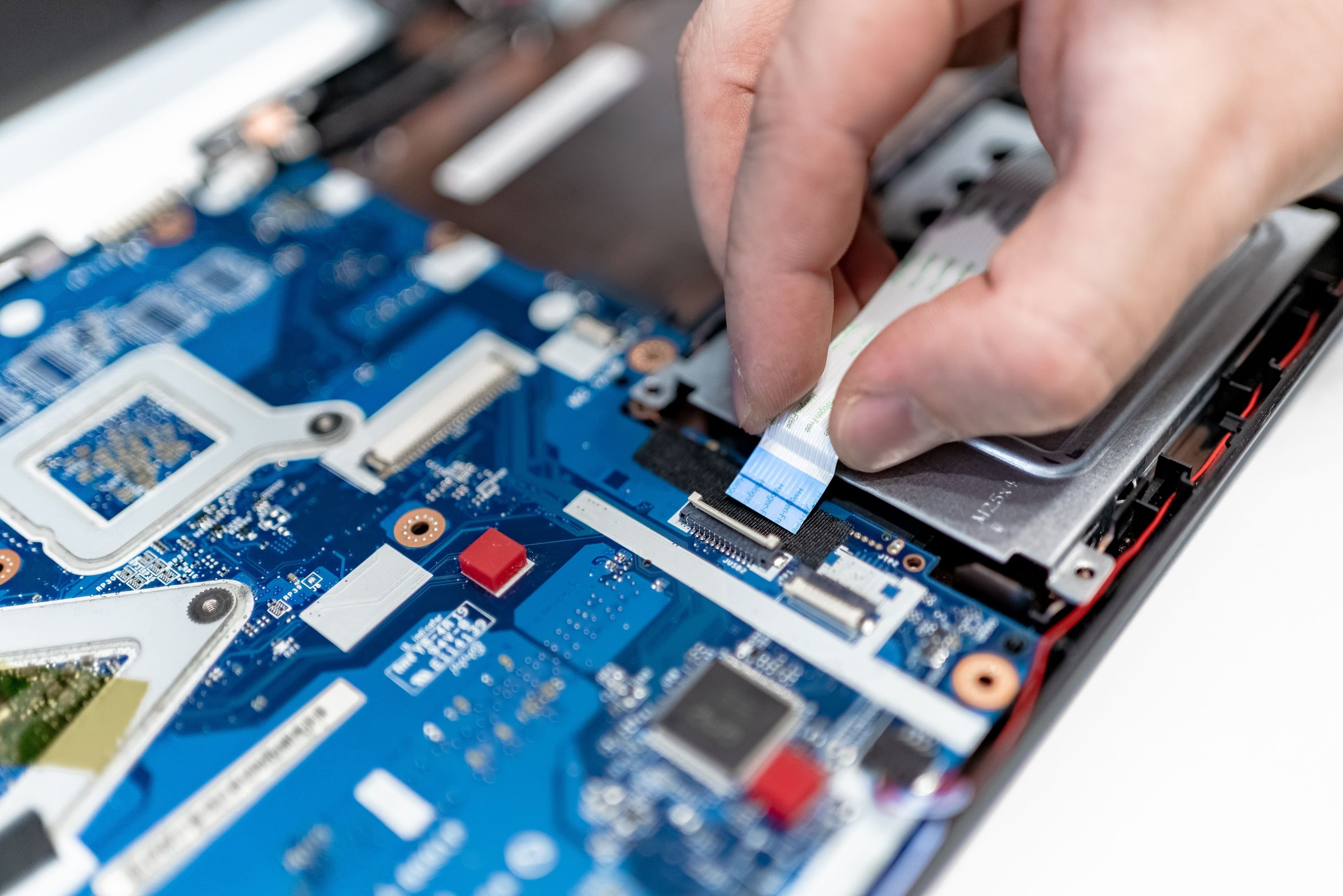 Technician repairing a laptop