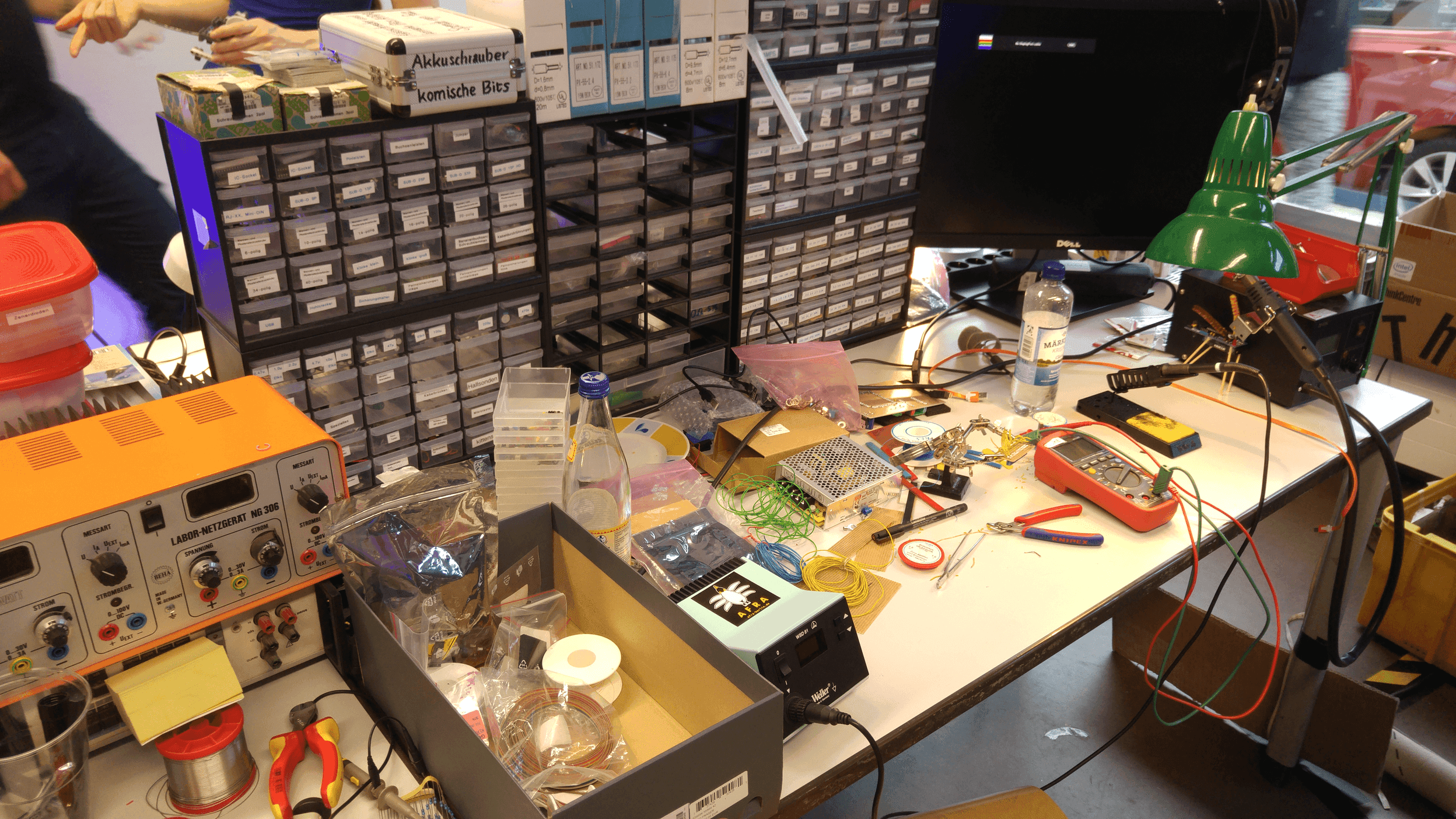 Computer repair workbench with tools and devices